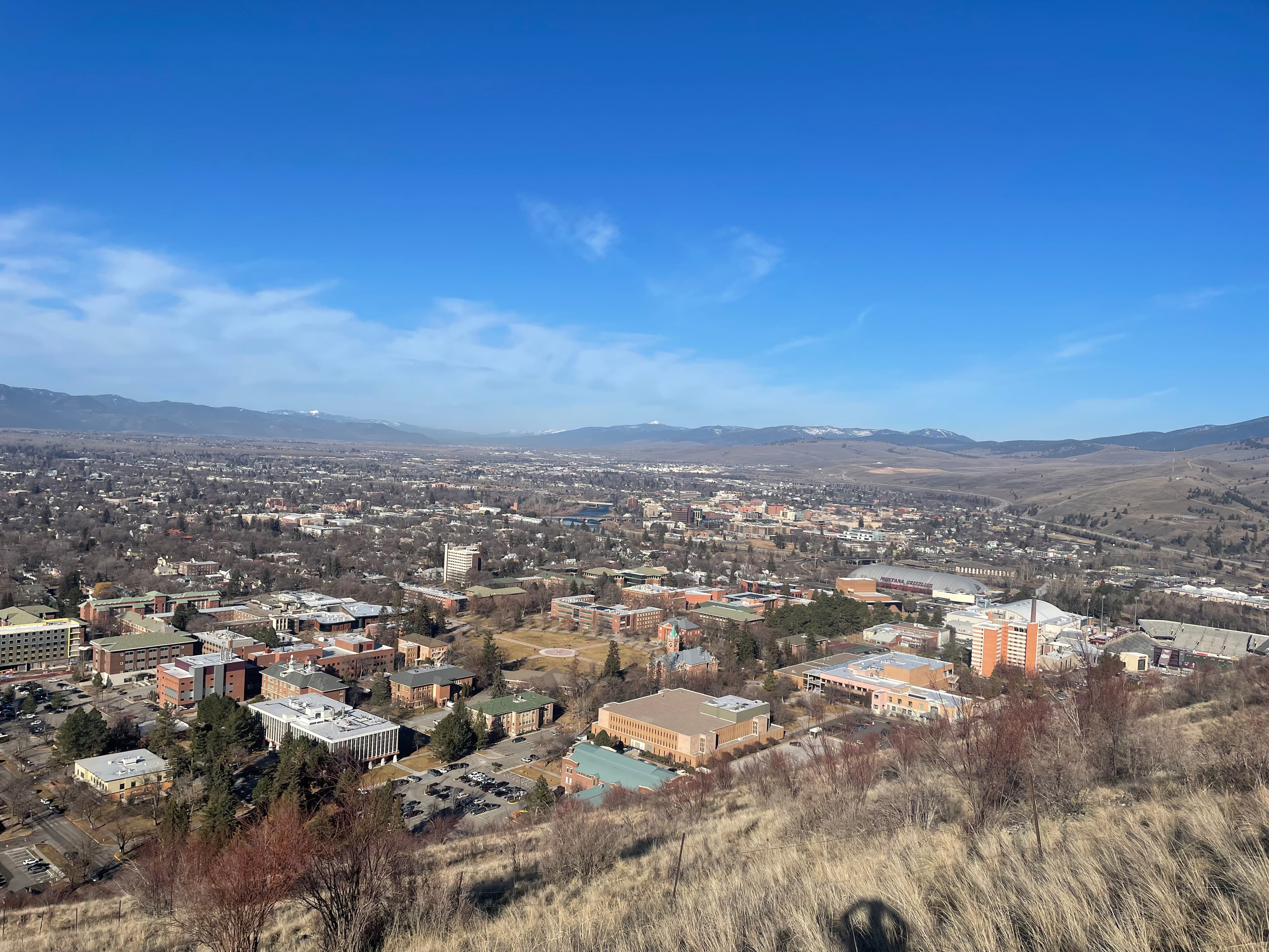 Snow-capped mountains surrounding Missoula Montana viewed from Mount Sentinel trail - pawn shop missoula montana community | Missoula MT