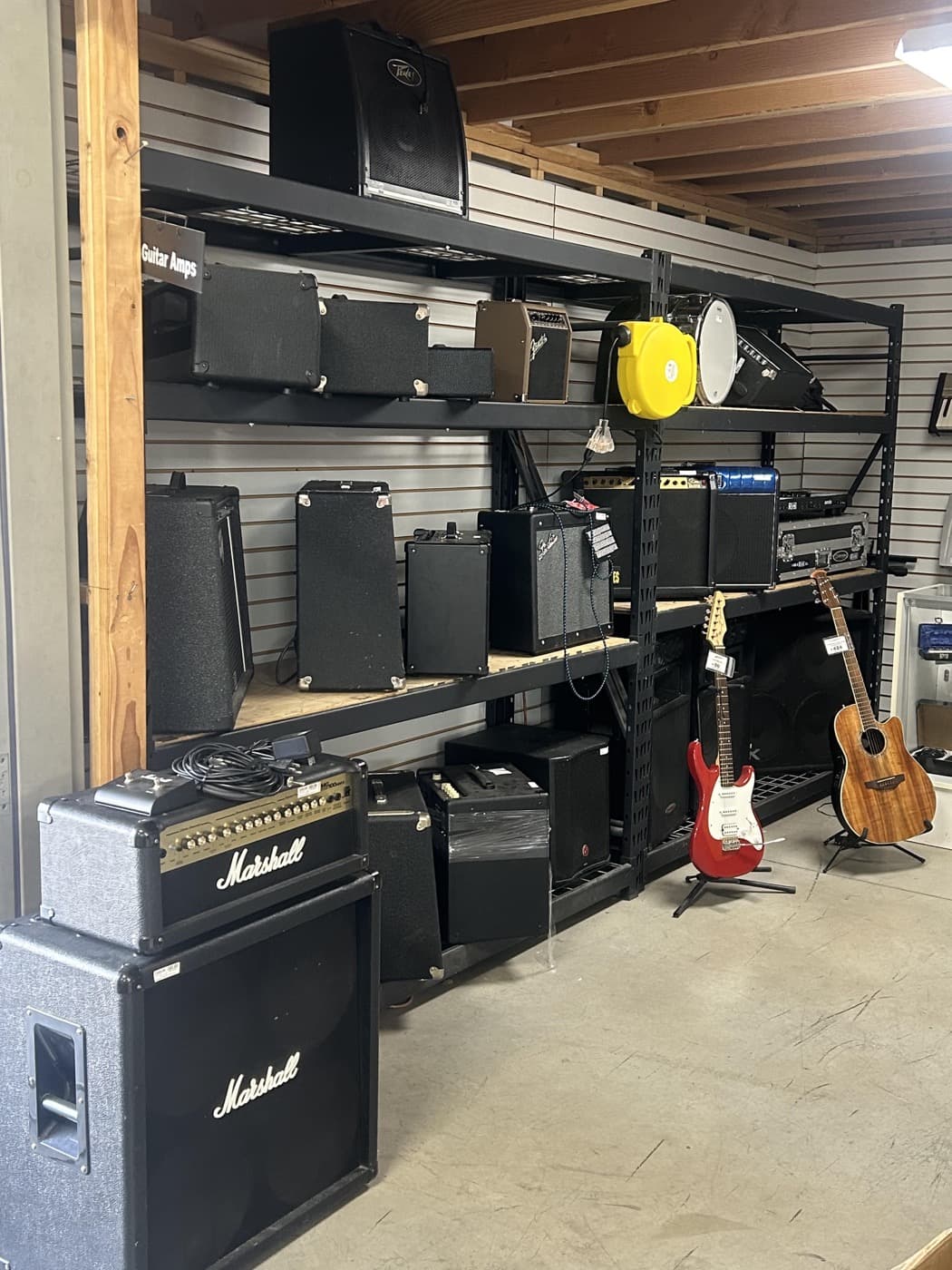 Guitar amplifiers and guitars on the Cash 1 Pawn sales floor