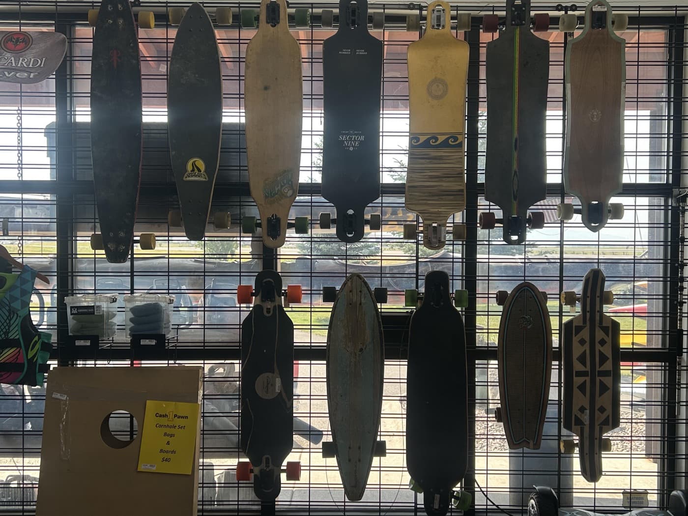 Longboards and skateboards in the Cash 1 Pawn sporting goods section